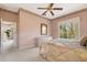 Main bedroom with ensuite bathroom access and a large window at 7153 Drewrys Blf, Bradenton, FL 34203