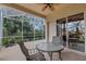 Peaceful screened porch with glass doors and outdoor seating at 7153 Drewrys Blf, Bradenton, FL 34203