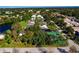 Aerial view showing tennis courts and community at 7312 Cloister Dr # 7312, Sarasota, FL 34231