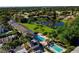 Aerial view of community pool, building, and lake at 7312 Cloister Dr # 7312, Sarasota, FL 34231