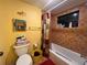 Yellow-walled bathroom with a tiled shower/tub combo at 7312 Cloister Dr # 7312, Sarasota, FL 34231