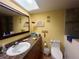 Clean bathroom with tiled floor and a beachy theme at 7312 Cloister Dr # 7312, Sarasota, FL 34231