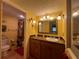 Second bathroom with a yellow vanity and tiled floor at 7312 Cloister Dr # 7312, Sarasota, FL 34231