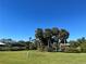 Landscaped community with lush green grass and palm trees at 7312 Cloister Dr # 7312, Sarasota, FL 34231