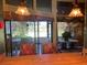 Dining area with sliders leading to a patio overlooking the golf course at 7312 Cloister Dr # 7312, Sarasota, FL 34231