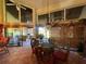 Dining area with glass table, patio access, and view of the kitchen at 7312 Cloister Dr # 7312, Sarasota, FL 34231