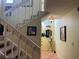 Bright entryway with tiled flooring, staircase, and tasteful wall art at 7312 Cloister Dr # 7312, Sarasota, FL 34231