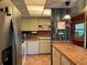 Well-maintained kitchen with stainless steel appliances and wood countertops at 7312 Cloister Dr # 7312, Sarasota, FL 34231