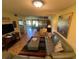 Spacious living room featuring a comfy leather sofa, ottoman, and large artwork at 7312 Cloister Dr # 7312, Sarasota, FL 34231