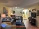 Open and airy living room with ample seating and tile flooring at 7312 Cloister Dr # 7312, Sarasota, FL 34231