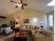 Relaxing living room featuring a large sectional sofa and a ceiling fan at 7312 Cloister Dr # 7312, Sarasota, FL 34231