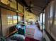 Peaceful screened porch with seating and a ceiling fan at 7312 Cloister Dr # 7312, Sarasota, FL 34231