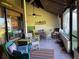 Relaxing screened-in porch with outdoor furniture and tiled flooring at 7312 Cloister Dr # 7312, Sarasota, FL 34231