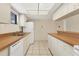 Modern kitchen with white cabinetry and a dishwasher at 845 Mecca Dr # D, Sarasota, FL 34234