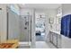 Bathroom with walk-in shower and view to bedroom at 8721 Ocean Tides Cv, Parrish, FL 34219