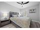 Bedroom with a queen bed, nightstand and ceiling fan at 11216 Coralbean Dr, Lakewood Ranch, FL 34202