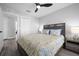 Bedroom with a yellow floral comforter and nightstands at 11216 Coralbean Dr, Lakewood Ranch, FL 34202