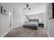 Spacious bedroom with a ceiling fan and wood flooring at 11216 Coralbean Dr, Lakewood Ranch, FL 34202