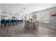 Open concept dining area with seating for six at 11216 Coralbean Dr, Lakewood Ranch, FL 34202