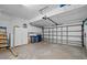 Two-car garage with storage cabinets and overhead storage at 11216 Coralbean Dr, Lakewood Ranch, FL 34202