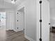 Clean hallway with white doors and light gray walls at 11216 Coralbean Dr, Lakewood Ranch, FL 34202