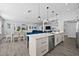 Open concept kitchen features a large island and breakfast bar at 11216 Coralbean Dr, Lakewood Ranch, FL 34202