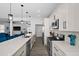 Modern kitchen with stainless steel appliances and white cabinetry at 11216 Coralbean Dr, Lakewood Ranch, FL 34202