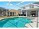 Inviting screened pool with a unique freeform design at 11216 Coralbean Dr, Lakewood Ranch, FL 34202