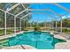 Private screened pool with lush landscaping views at 11216 Coralbean Dr, Lakewood Ranch, FL 34202