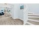 Modern staircase with white risers and wood treads, leading to the second floor at 11216 Coralbean Dr, Lakewood Ranch, FL 34202