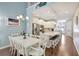 Bright dining area with white table and chairs at 11717 Meadowgate Pl, Bradenton, FL 34211