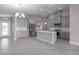 Modern kitchen with gray cabinets and island at 12513 Oak Hill Way, Parrish, FL 34219