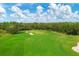 Golf course aerial view showing players on the green at 13828 Messina Loop # 204, Lakewood Ranch, FL 34211