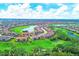 Aerial view of community with golf course and lake features at 13828 Messina Loop # 204, Lakewood Ranch, FL 34211