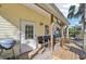 Relaxing back porch with wooden deck and seating at 16102 Camas Ave, Port Charlotte, FL 33954