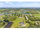 Aerial view of a luxury home community with lakes and lush landscaping at 18307 White Fang Ct, Parrish, FL 34219