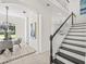 Modern staircase with black and white accents at 18307 White Fang Ct, Parrish, FL 34219