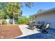 Spacious backyard patio with pavers and a dining table set at 1905 Jasmine Dr, Sarasota, FL 34239