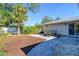 Spacious backyard patio with pavers and a dining table set at 1905 Jasmine Dr, Sarasota, FL 34239