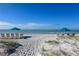 Beach access with lounge chairs and umbrellas at 2055 Gulf Of Mexico Dr # G2-214, Longboat Key, FL 34228