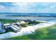Aerial view of beachfront property with resort and white sand beach at 2110 Benjamin Franklin Dr # 108, Sarasota, FL 34236