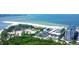 Aerial view showing resort, beachfront property, and parking at 2110 Benjamin Franklin Dr # 108, Sarasota, FL 34236