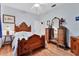 Guest bedroom with hardwood floors and antique furniture at 2304 89Th Nw St, Bradenton, FL 34209