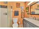 Clean bathroom with shower stall, toilet and vanity with granite countertop at 2431 Golf Course Dr # 703, Sarasota, FL 34234