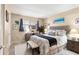 Bright bedroom with large window, neutral paint, and calming decor offers a relaxing retreat at 2431 Golf Course Dr # 703, Sarasota, FL 34234