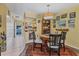 Dining area with table, chairs, and view into living room at 2431 Golf Course Dr # 703, Sarasota, FL 34234