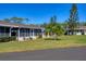 Well-maintained home with lush landscaping and a green lawn at 2431 Golf Course Dr # 703, Sarasota, FL 34234