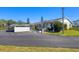 This is a nice image of the home's exterior and the parking area at 2431 Golf Course Dr # 703, Sarasota, FL 34234
