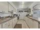 Well-lit kitchen features ample counter space and functional appliances at 2431 Golf Course Dr # 703, Sarasota, FL 34234