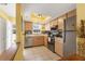 This bright kitchen features stainless steel appliances and neutral-toned cabinets at 2431 Golf Course Dr # 703, Sarasota, FL 34234